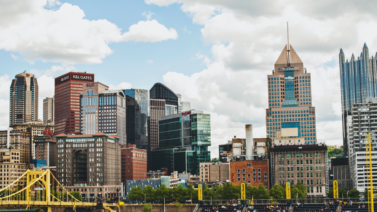 Pittsburgh skyline with a yellow bridge, showcasing the vibrant cityscape.