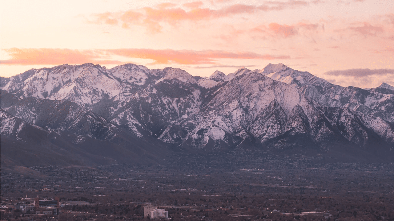 The Big Cottonwood mountains are covered in snow.