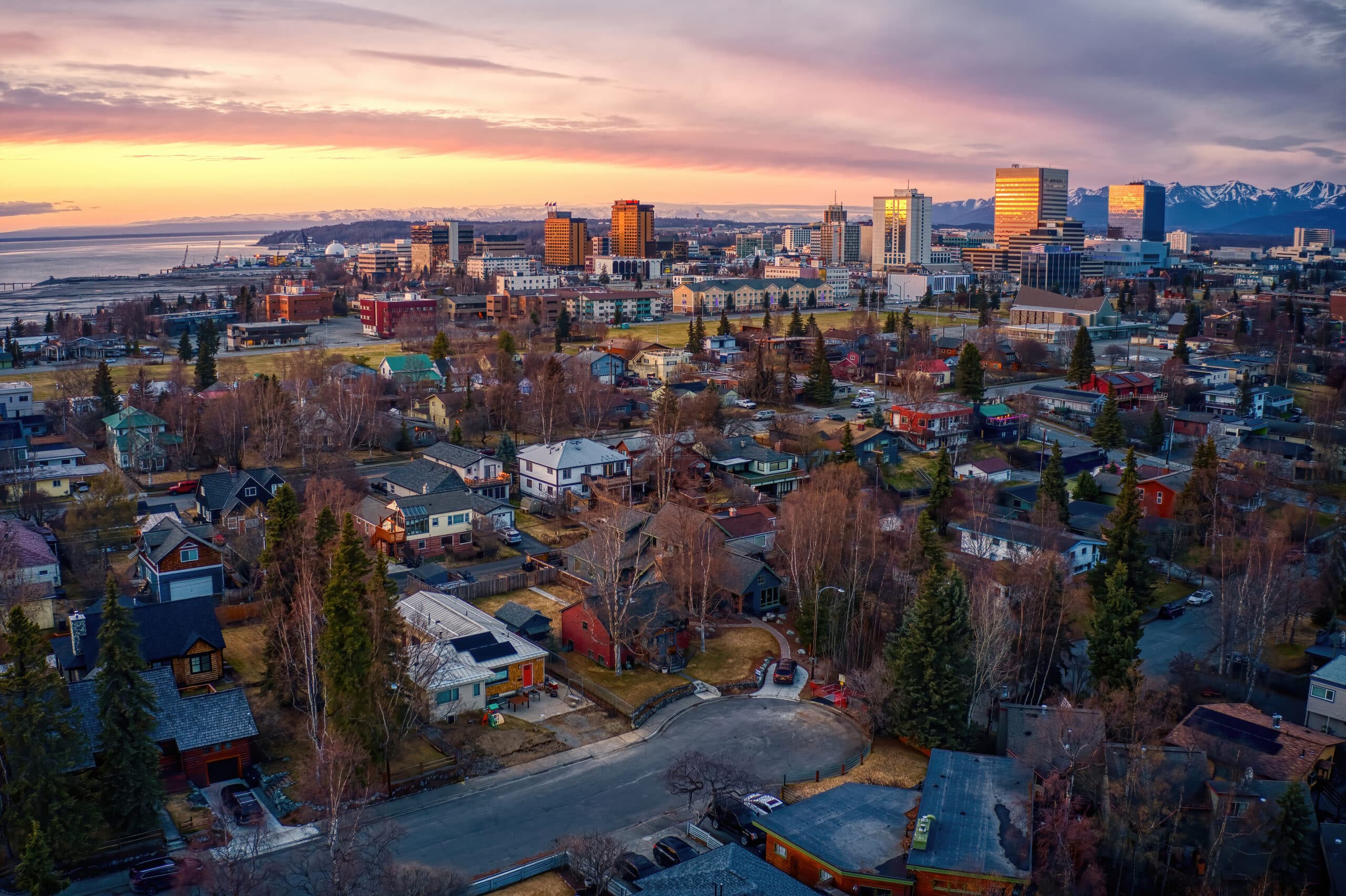 An aerial view of a city at sunset.