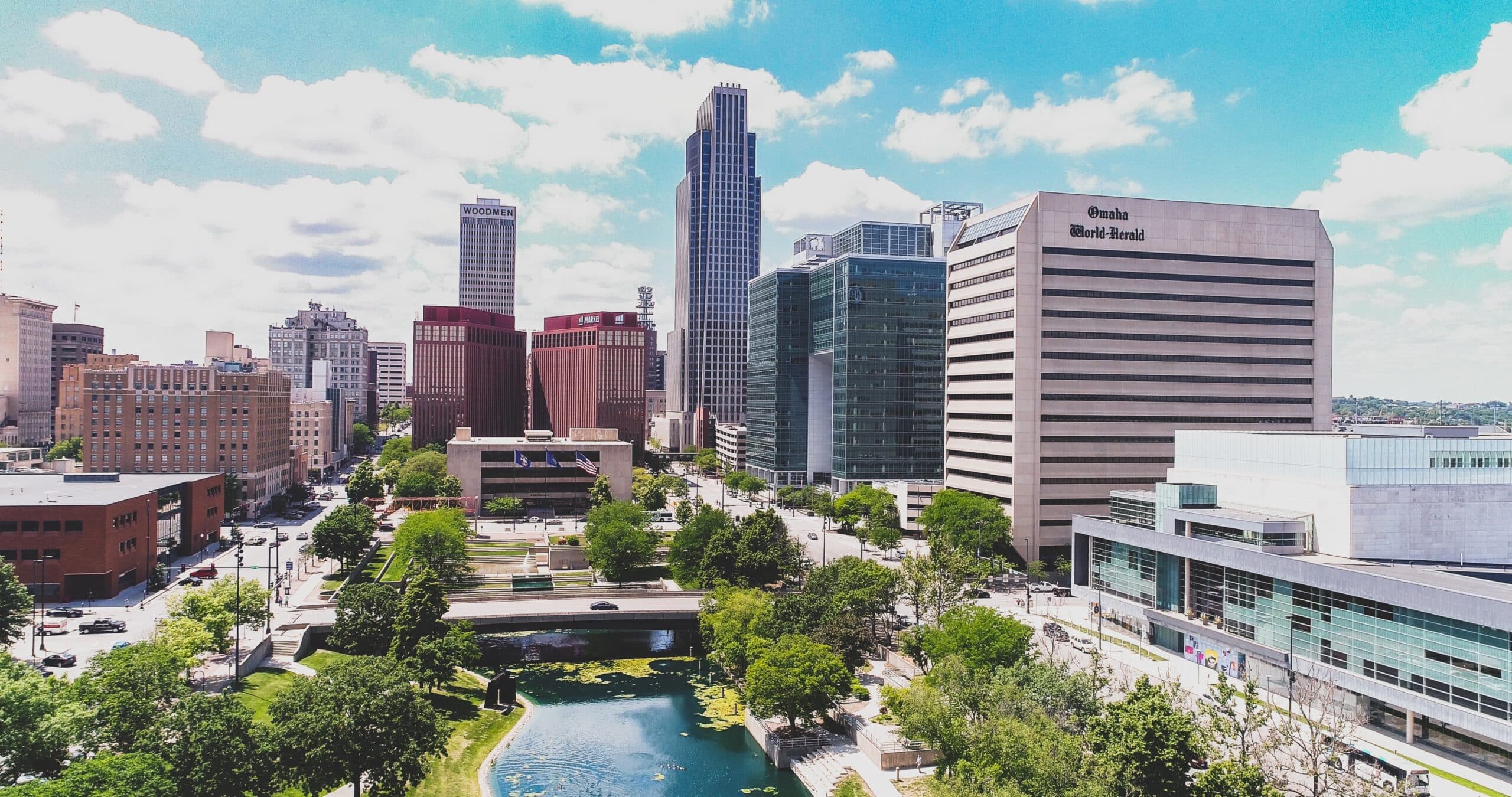 An aerial view of a city with tall buildings and trees.