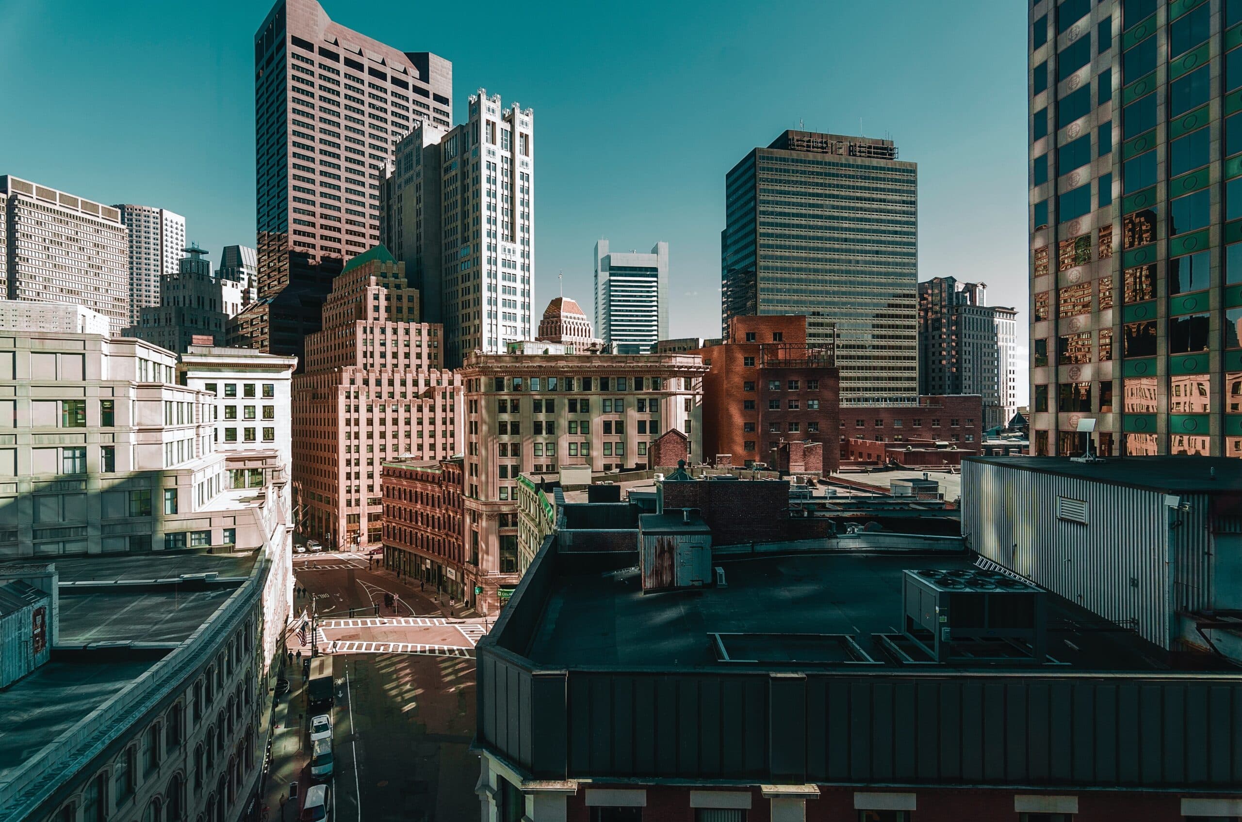 A view of a city from the top of a tall building.