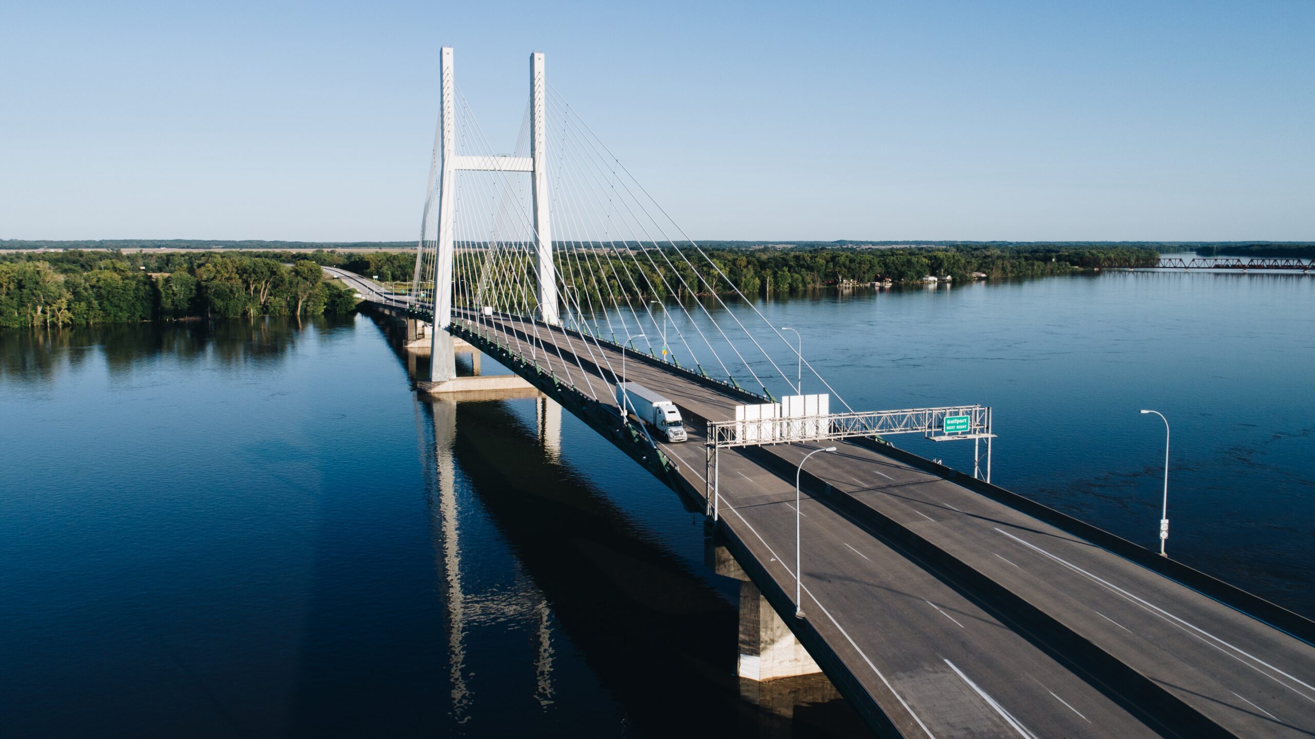 Aerial view of a river bridge during a marathon.