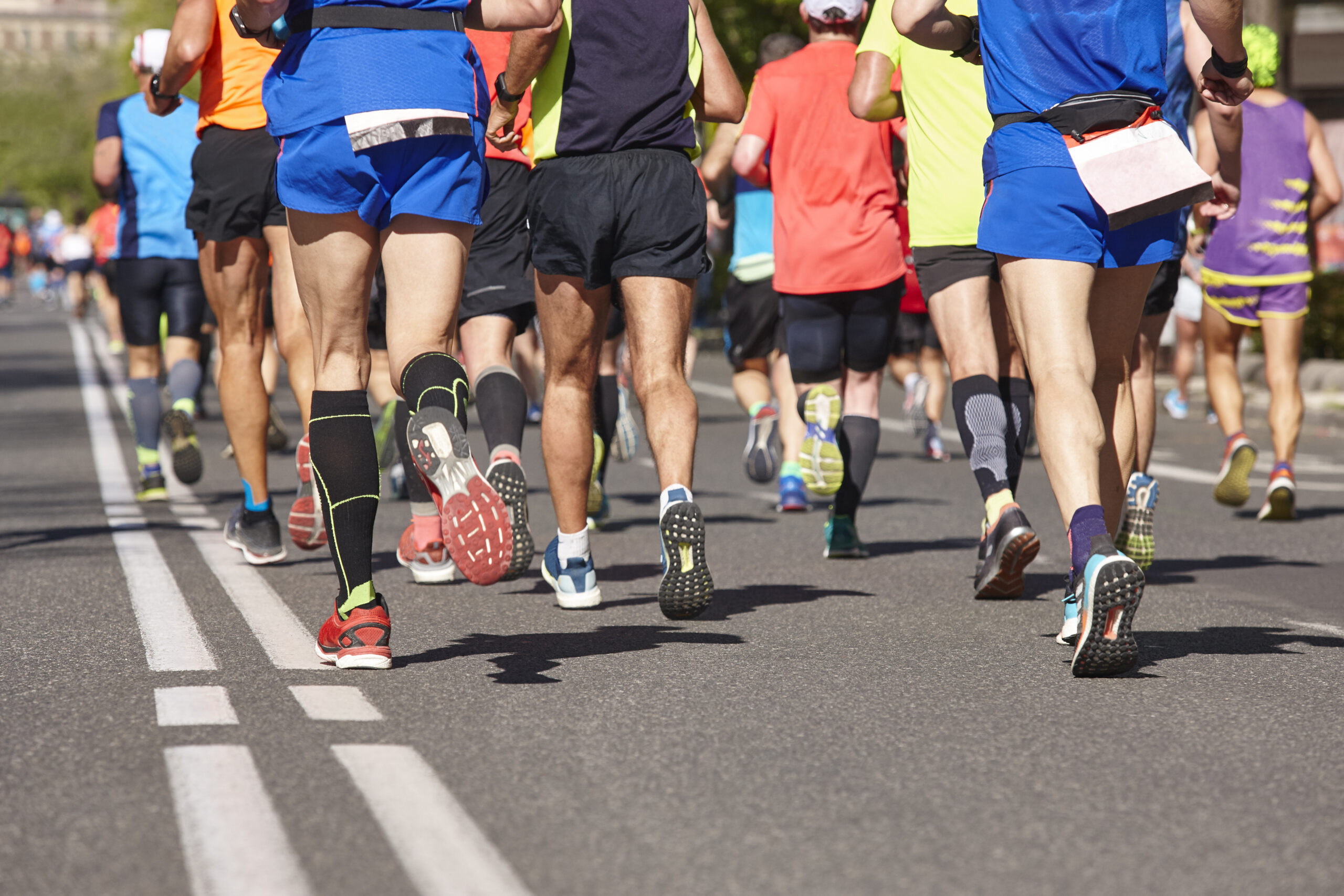 A long marathon with a group of people running.