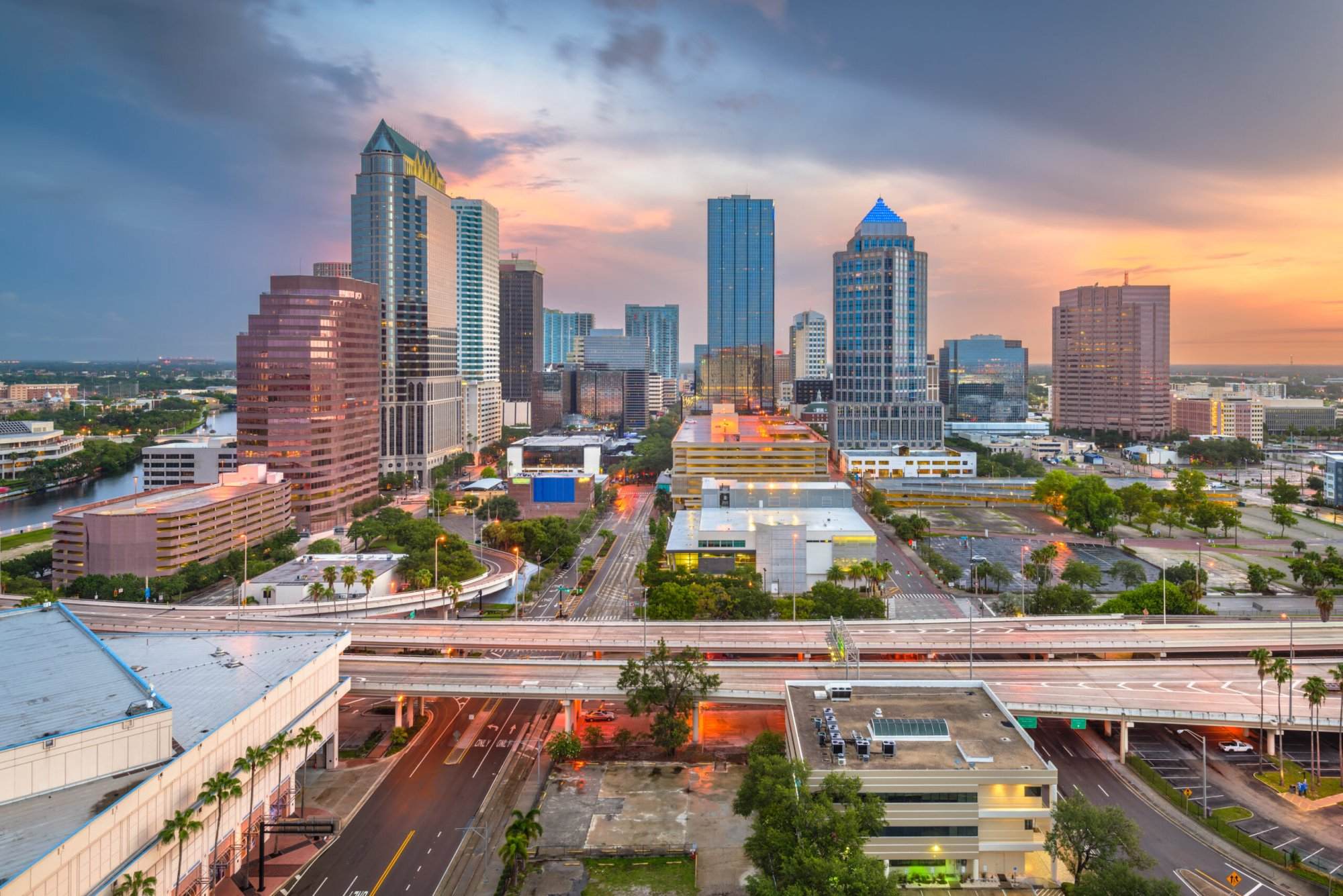 An aerial view of the city of tampa at sunset.